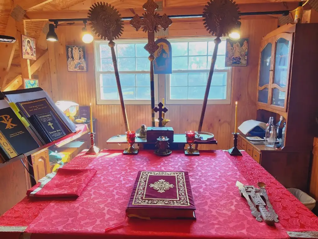 Close-up view of the altar table with liturgical items on it.