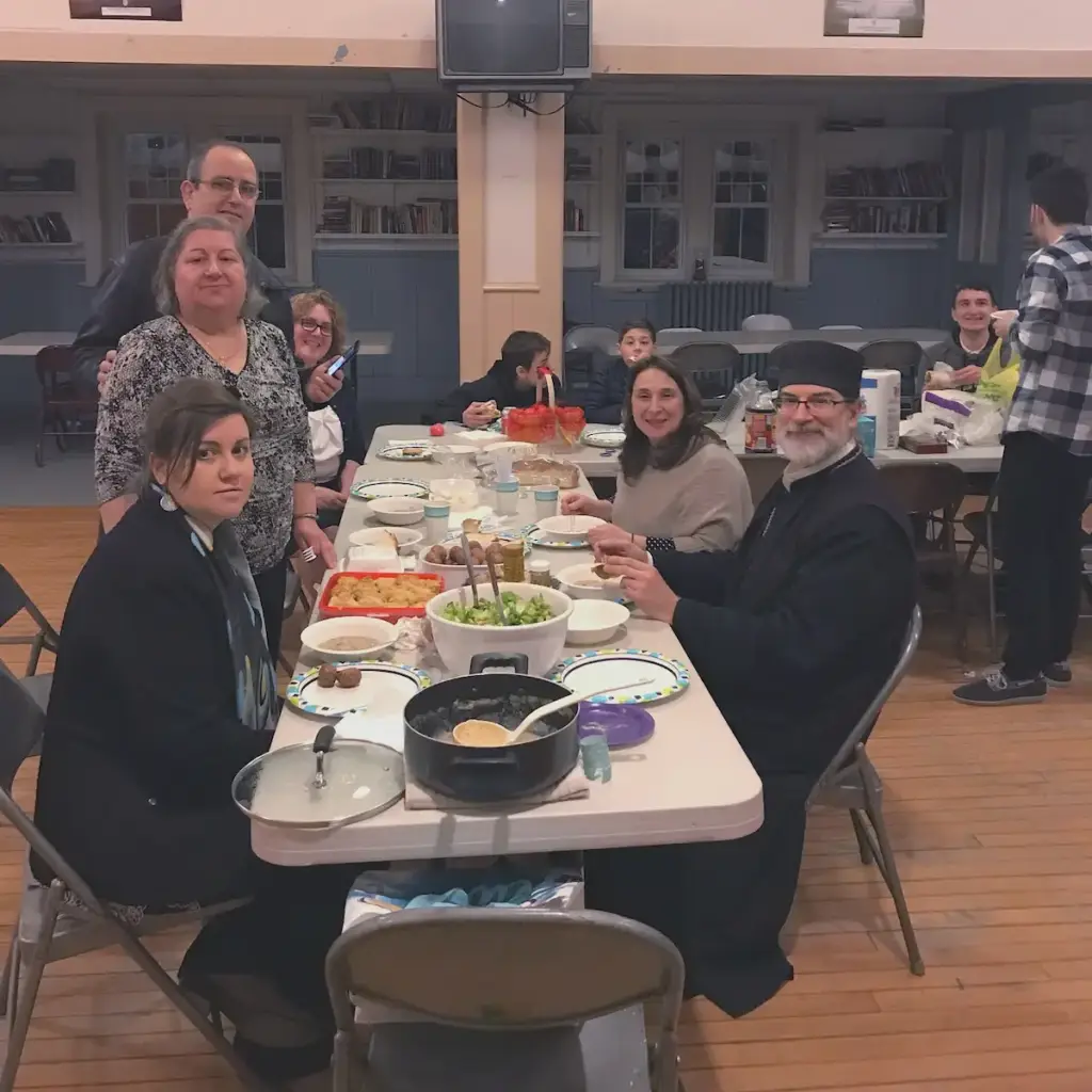 After a service, parishioners gather and smile.