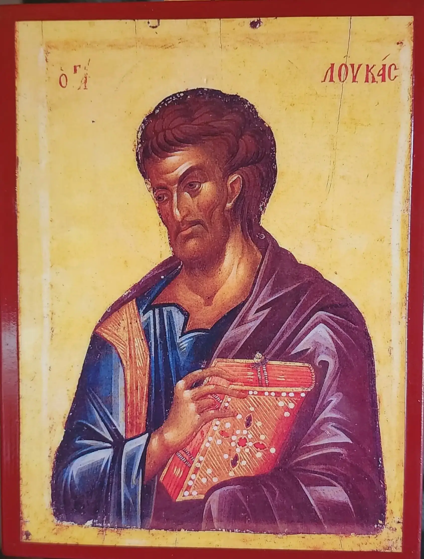 Icon of Saint Luke holding the Gospel.