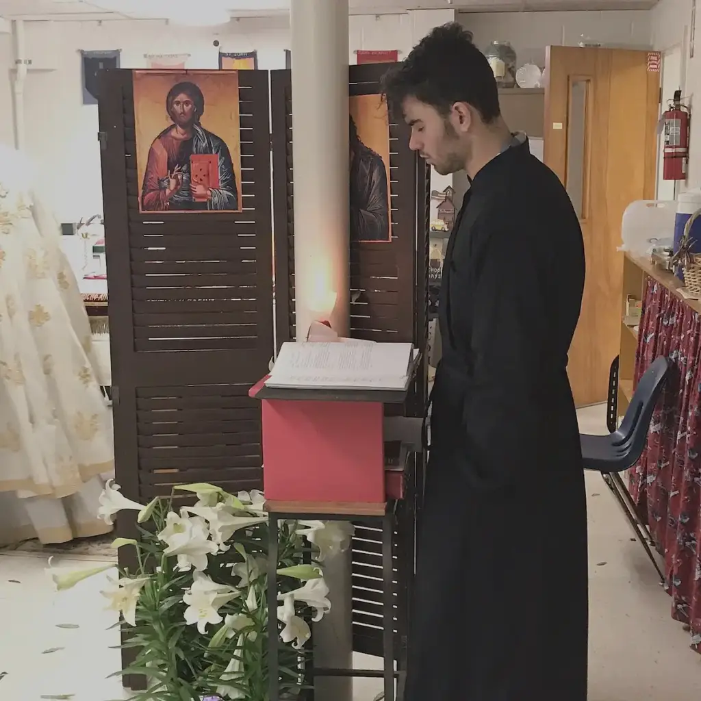 The chanter reading during a service.