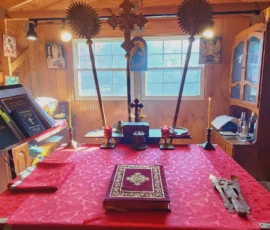 Close-up view of the altar table with liturgical items on it.