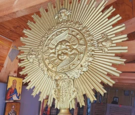Single liturgical fan displayed inside the church.