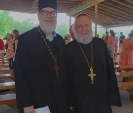 Father Gregory and another priest pose while overseeing a Russian Orthodox youth camp.