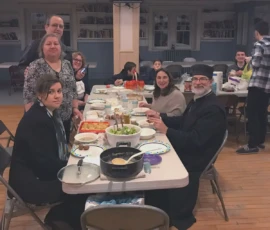 After a service, parishioners gather and smile.