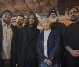 Parishioners and Father pose after a fellowship gathering.