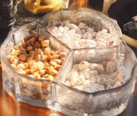 Close-up of a glass incense holder and three kinds of incense used during service.