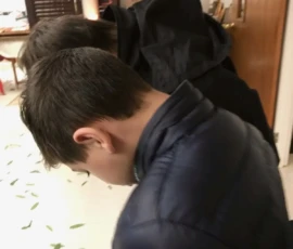 A young boy bowing during service.