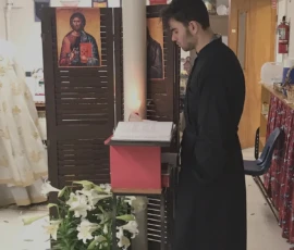 The chanter reading during a service.